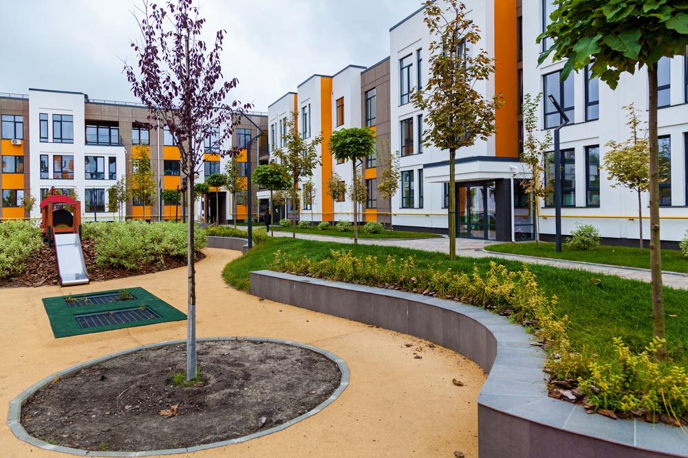 Courtyard-style housing with central play area, illustrating missing middle housing with shared community space