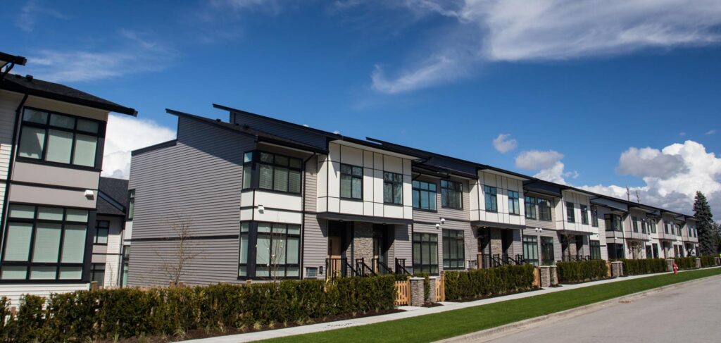Row of modern townhouses representing missing middle housing in a residential neighborhood.