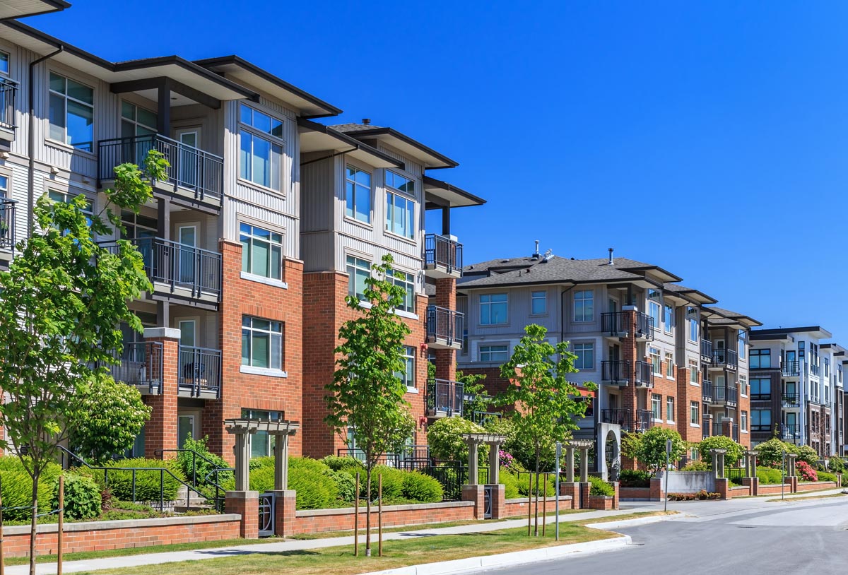Modern multiplex buildings in an urban, walkable neighborhood, representing missing middle housing.
